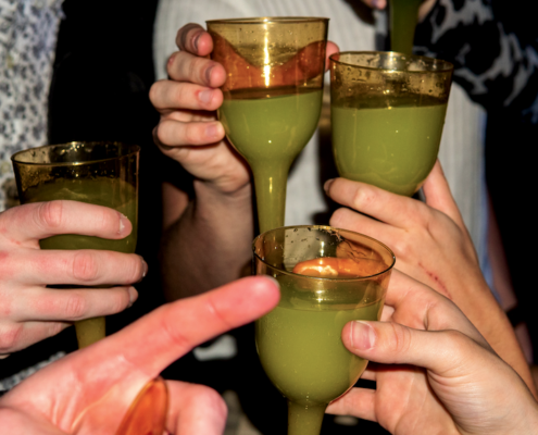 group enjoying absinthe at a party