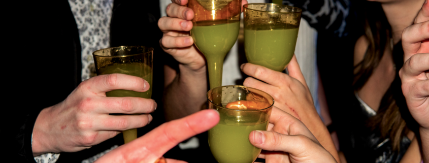 group enjoying absinthe at a party