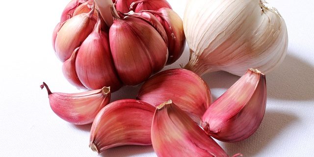 Is Garlic an Aphrodisiac? Discover this Sex-Boosting Food 1 closeup of two garlic bulbs to help illustrate the benefits of garlic