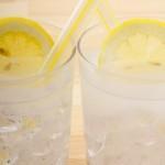 Limoncello Spritz: an unbelievably easy limoncello cocktail recipe 3 closeup of two side by side limoncello spritz cocktails in rocks glasses with ice and a lemon wheel garnish in each glass