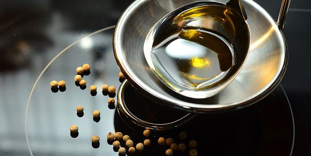 Metal bowl with vitamin E oil to illustrate the benefits of vitamin E