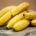 a bunch of bananas on a wooden table