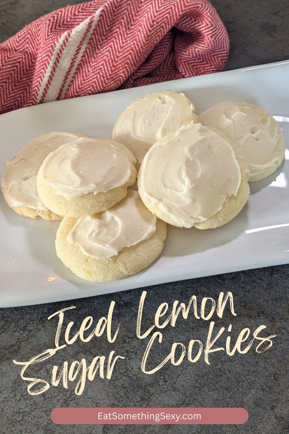 Iced Lemon Cookies 2 iced lemon sugar cookies graphic with the cookies on a white, rectangular plate and a red tea towel on a slate background with the text "iced lemon sugar cookies" in a marker font.