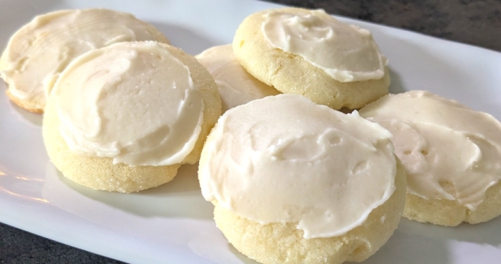 Iced Lemon Cookies 1 closeup of iced lemon cookies on a white, rectangular plate