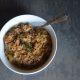 Overhead Look at Barley Risotto with Apple and Parmesan in a white bowl