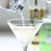 An Unforgettable Ginger Flavored Vodka Cocktail Recipe 2 Yazi Mischief - a spicy vodka drink being poured from a shaker into a martini glass