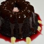 Closeup of Pomegranate Mini Bundt Cakes on a white plate