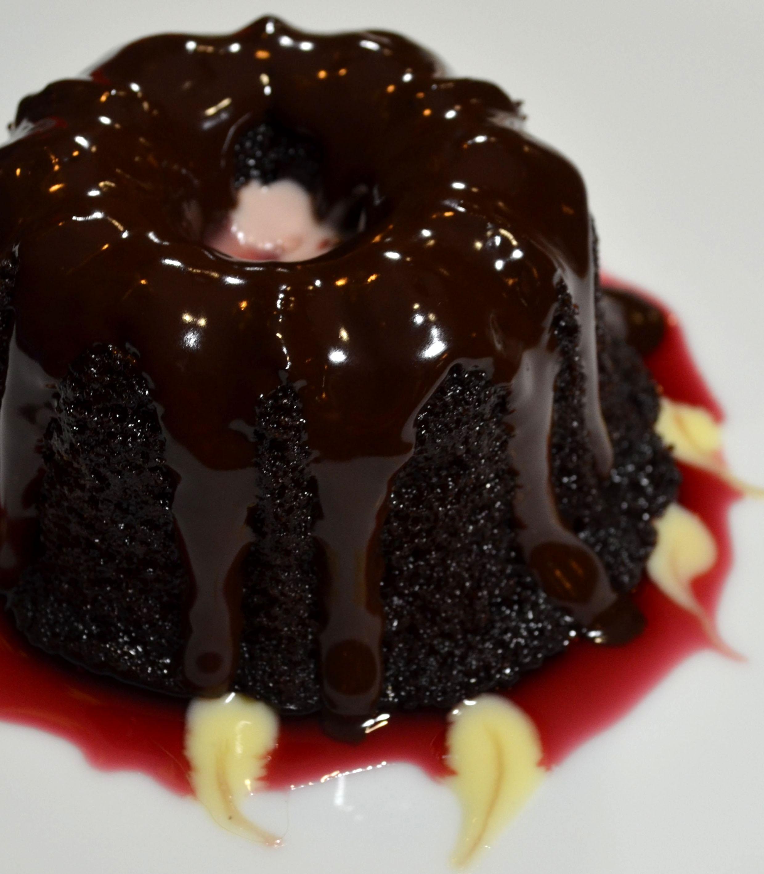 Pomegranate & Chocolate Mini Cakes Recipe 2 Closeup of Pomegranate Mini Bundt Cakes on a white plate