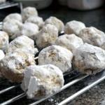 a dozen French Love Cakes on a rack