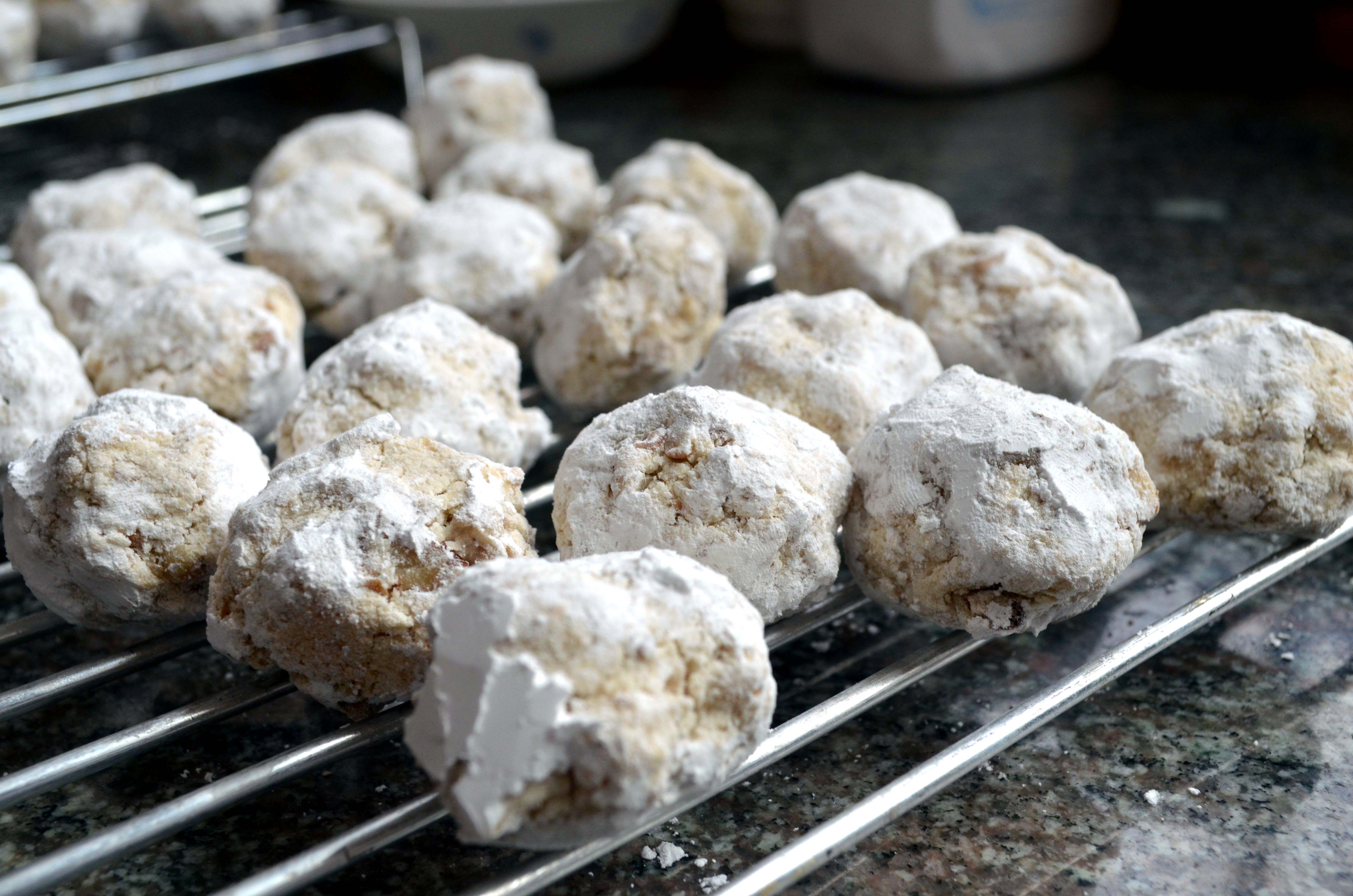 a dozen French Love Cakes on a rack