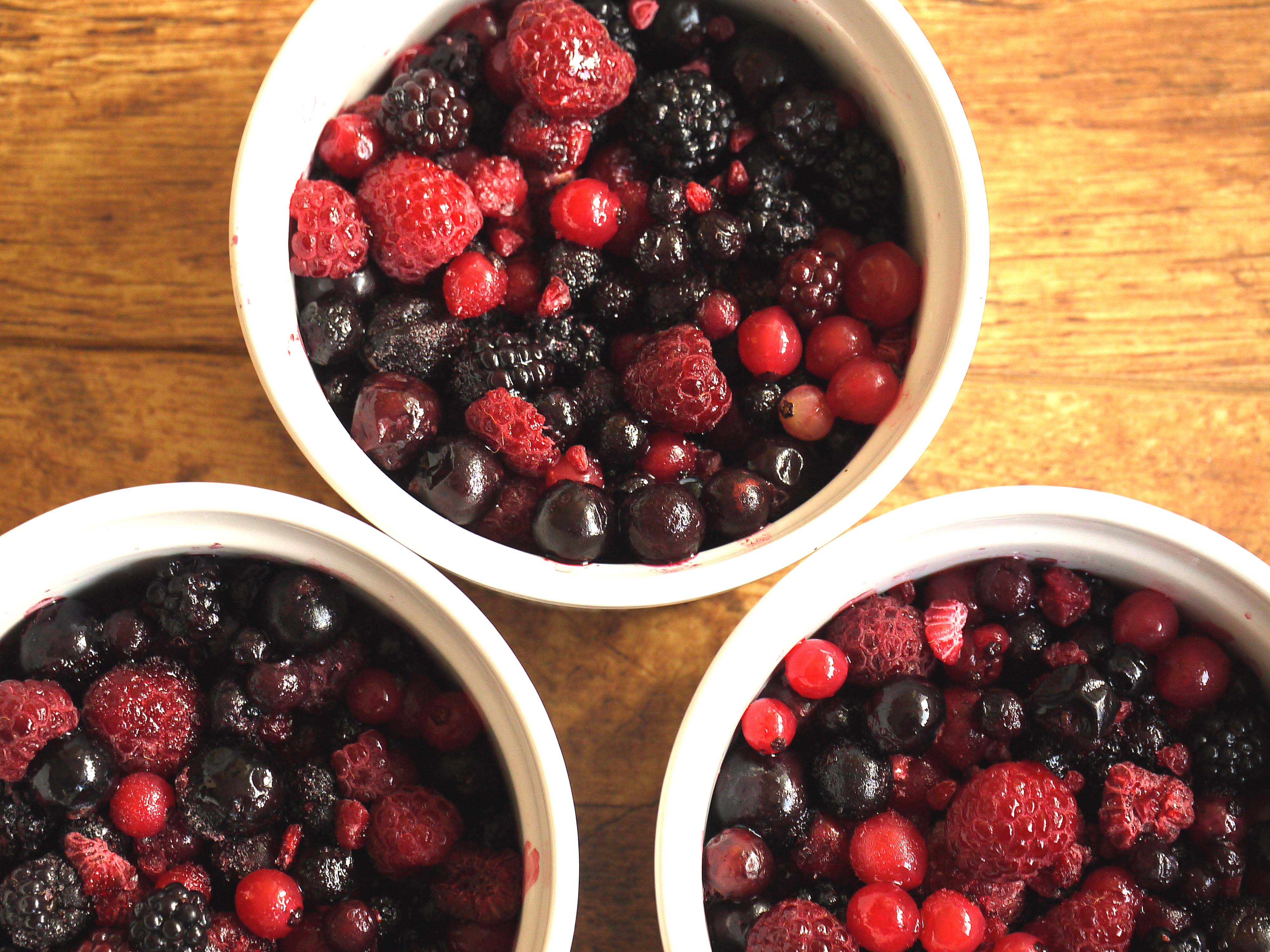 bowls of fresh berries to illustrate reducing refined sugar