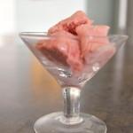 raspberry semifreddo in a martini glass on a gray background