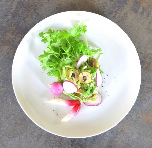 overhead shot of celery olive salad with breakfast radishes