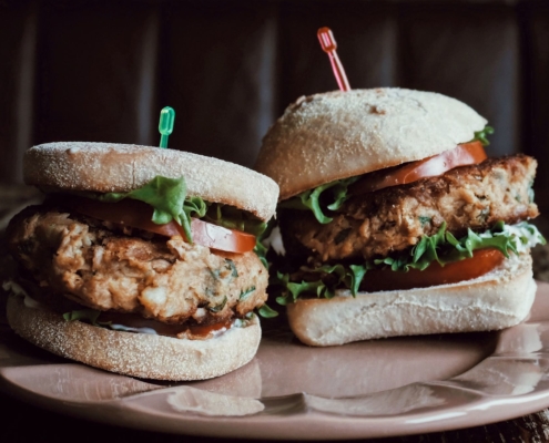 Spicy Sweet Potato Veggie Burger Recipe 7 2 Sweet Potato Veggie Burgers on a pink plate