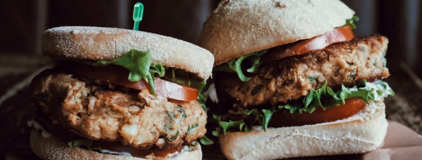 2 Sweet Potato Veggie Burgers on a pink plate