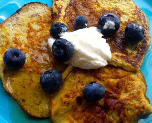 Two Ingredient Banana Pancakes topped with blueberries
