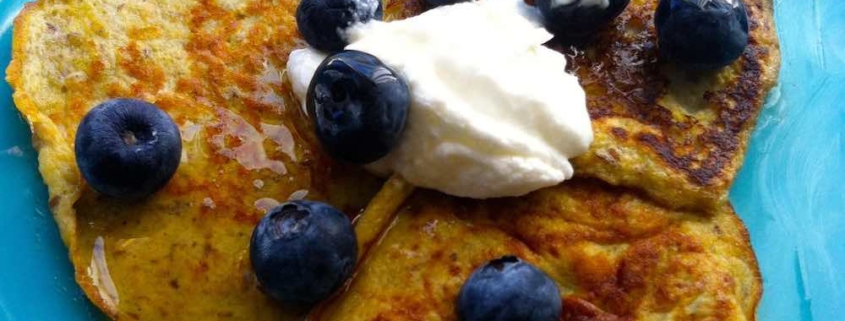 Two Ingredient Banana Pancakes topped with blueberries