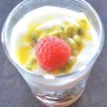 Closeup of Passion Fruit Quinoa Greek Yogurt Parfait with a raspberry on top