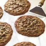 Dark Chocolate Chunk Cookies with Fiori di Sicilia 3 Closeup of Carl's Dark Chocolate Chunk Cookies on a baking sheet with a spatula
