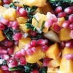 Vegan Stuffed Acorn Squash Recipe 2 Closeup of Vegan Stuffed Acorn Squash with pomegranate and spinach