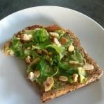 closeup of avocado toast with cashew and coconut