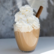 coffee with a kick drink in a glass cup, topped with whipped cream