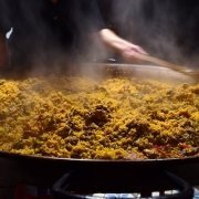 closeup of seafood paella in a traditional pan