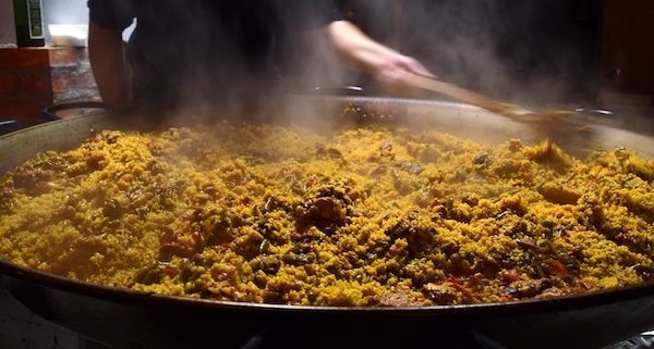 closeup of seafood paella in a traditional pan