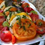 Caprese Salad with Cherry Tomatoes For Two 2 closeup of tomato mozzarella salad on a white serving platter