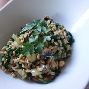 closeup of quick cooking farro with mushrooms in a large, white bowl