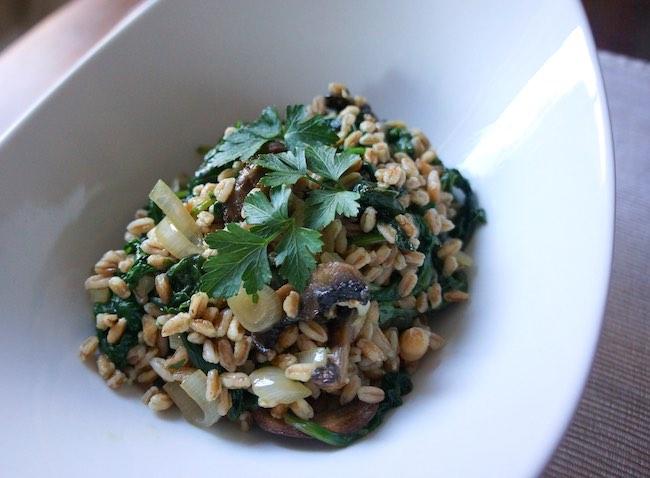 closeup of quick cooking farro with mushrooms in a large, white bowl