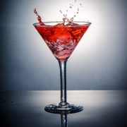 The Aphrodisiac, a pomegranate vodka cocktail in a martini glass