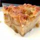 Closeup of Chevre Apple Bread Pudding with Champagne on a White Plate