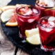Red Wine Citrus Sangria Recipe 24 three glasses of red wine citrus sangria on a black tray with wedges of citrus for accents