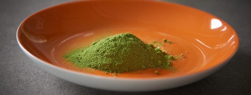 Orange bowl with pure moringa powder to illustrate moringa powder benefits