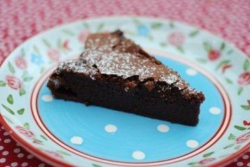 Slice of Sharffen Berger gluten free Chocolate Cake on a blue plate