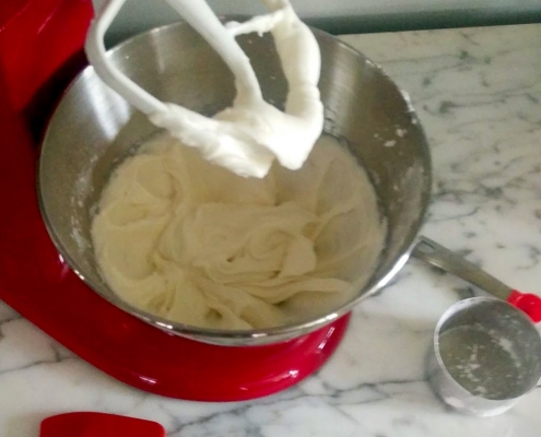 Crème Fraîche Frosting Recipe 7 Creme Fraiche Frosting in a red Kitchenaid mixer