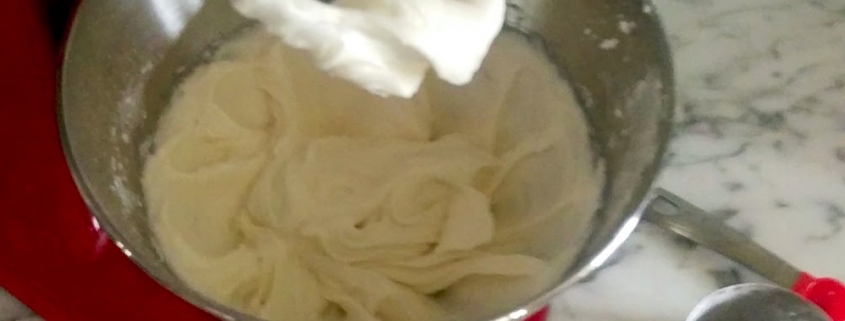 Creme Fraiche Frosting in a red Kitchenaid mixer