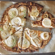 Easy Cheese and Onion Tart Recipe 2 Overhead shot of easy cheese and onion tart on parchment paper