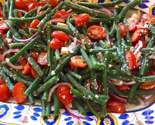 closeup of greek green bean tomato feta salad