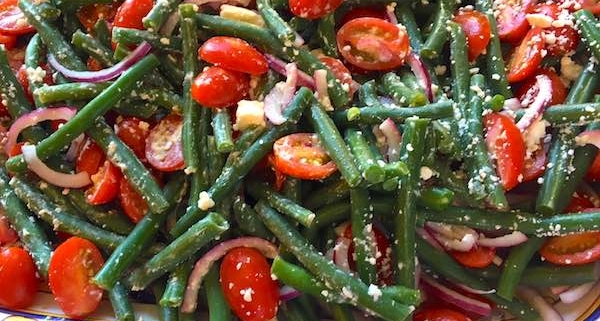 closeup of greek green bean tomato feta salad