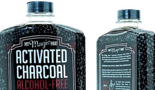 closeup of front and back of My Magic Mud mouthwash bottle