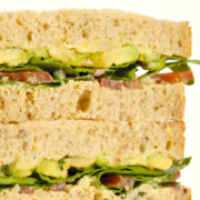 closeup of Picnic Sandwiches with tomato, avocado, bacon and butter lettuce