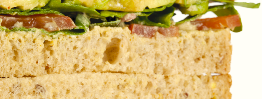 closeup of Picnic Sandwiches with tomato, avocado, bacon and butter lettuce