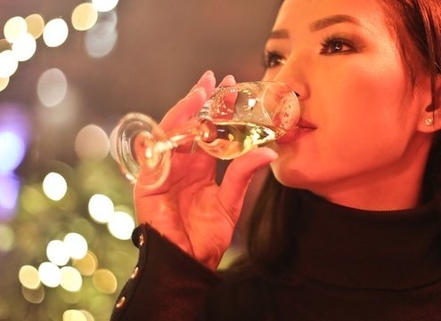 closeup of woman drinking dessert wine