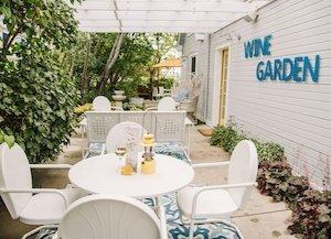 Wine Garden at Lithia Springs Resort with a white table set for lunch in the foreground