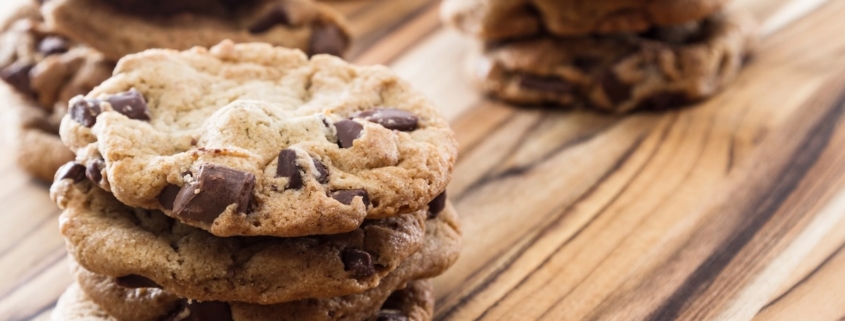 a stack of chipotle chocolate chip cookies with two more stacks in the background