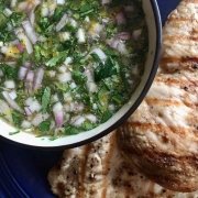 Fast & Easy Mojo Recipe 2 Mojo sauce in a white bowl with grilled chicken on the side