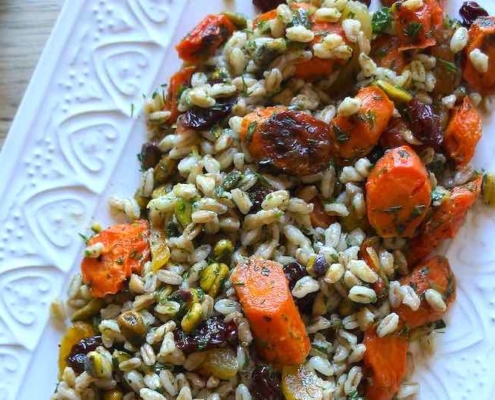 Recipe for Mediterranean Farro Salad with Dried Fruits 1 closeup of Mediterranean Farro Salad on a white platter