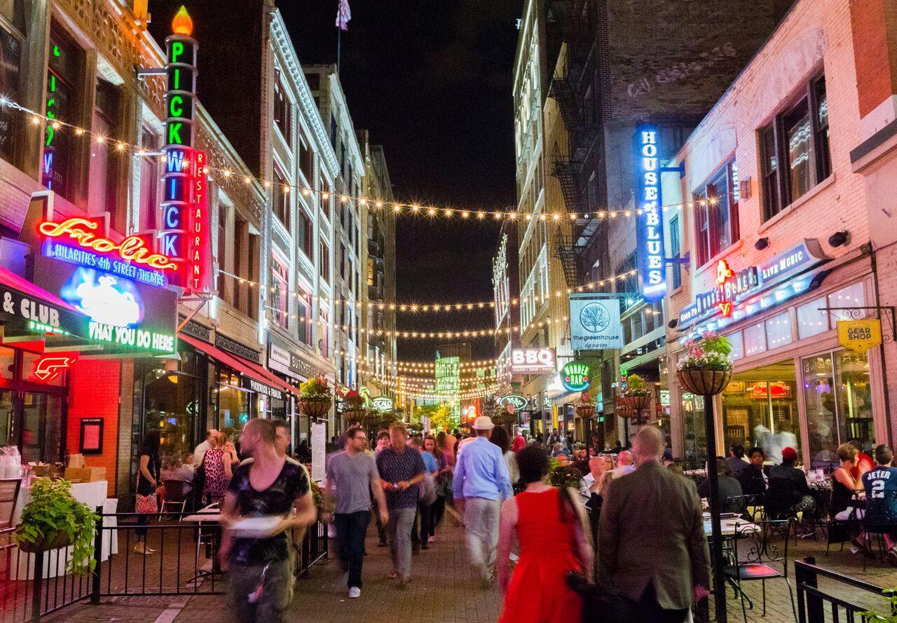 People strolling among Cleveland restaurants at night